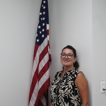 Kimberly Lapensee next to flag